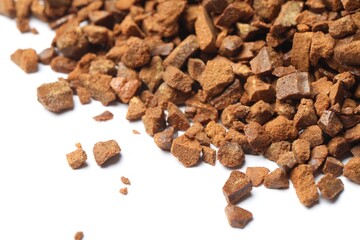 Pile of chicory granules on white background, closeup