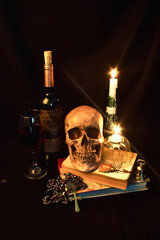 vanitas, skull over a book and another objects around, halloween 