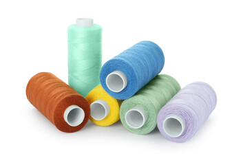 Set of different colorful sewing threads on white background