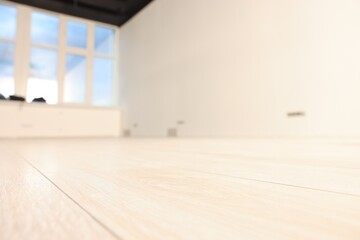 Empty room with new white laminated flooring, closeup