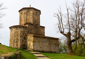 Fototapeta na wymiar View of small Church of Archangel Michael in Georgian Orthodox Nekresi monastery complex in Kakheti on spring day