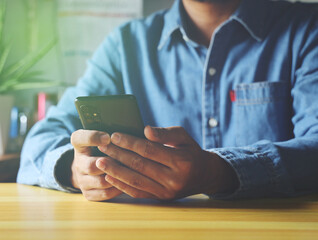 businessman using smartphone Modern businessman at  office. Freelancer at work.