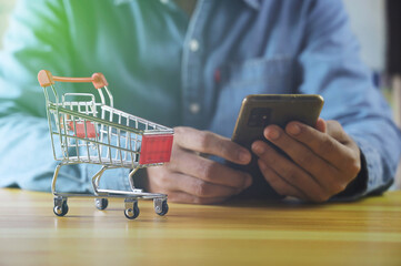 businessman using smartphone shopping with smartphone application, online payment, banking and online shopping at the office, Digital money transfer, banking and e commerce concept