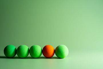 Soft foam balls over a green background,team concept,Communication concept