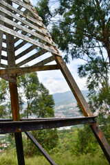 Obraz premium metal structure / summit cross on top of a peak in the city