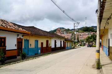 Fototapeta na wymiar typical colombian village street and colored houses