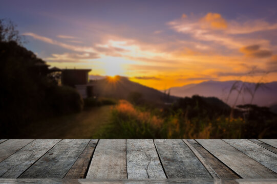 beautiful sunset with landscape and wooden table in balcony ,can use for advertising product.abstract, advertise, background, beautiful, beauty, blue, board, cloud, country, dark, deck, design, desk, 
