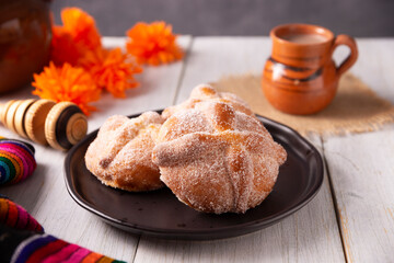 Pan de Muerto. Typical Mexican sweet bread that is consumed in the season of the day of the dead. It is a main element in the altars and offerings in the festivity of the day of the dead.