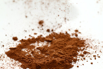 Close up of cocoa powder on white background
