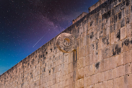 Detail of hoop ring at ball game court, Gran Juego de Pelota of Chichen Itza archaeological site in Yucatan, Mexico with Milky Way Galaxy stars night sky