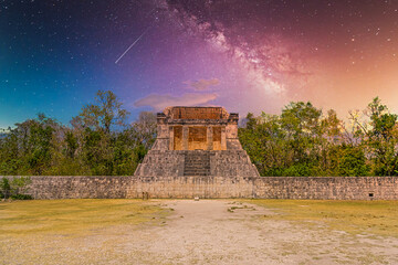 Fototapeta na wymiar Temple of the Bearded Man at the end of Great Ball Court for playing pok-ta-pok near Chichen Itza pyramid, Yucatan, Mexico. Mayan civilization temple ruins with Milky Way Galaxy stars night sky