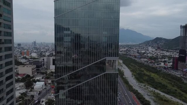 big crystal builing in a cloudy day with a panoramic view