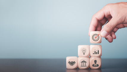 success and business target concept,Determine organizational efficiency improvement strategies,Planning growth goals in the industry,human hand stacking wooden blocks