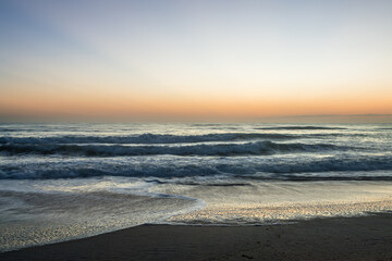 Fototapeta na wymiar Beautiful Sunrise - Long Exposure Beach waves sand