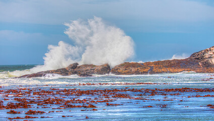 Rocky coastline on Diaz Point with strong sea wave - Luederitz, Namibia