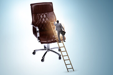 Businessman in the career concept climbing chair