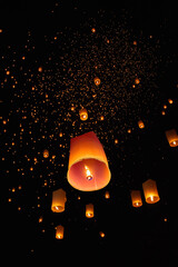 Tourist floating sky lanterns in Loy Krathong festival , Chiang Mai ,Thailand.