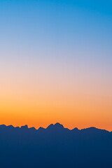 Background of colorful sky concept: Dramatic sunset with twilight color sky and clouds