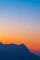 Background of colorful sky concept: Dramatic sunset with twilight color sky and clouds