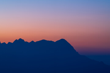 Background of colorful sky concept: Dramatic sunset with twilight color sky and clouds