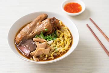 egg noodles with stewed and braised duck in brown soup
