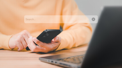 Man using a mobile phone in the room for searching browsing internet data information. Business concept for smartphone using search with your website.