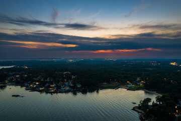 Aerial view at Branford Point in Branford, CT with New Haven, CT in the background during sunset - obrazy, fototapety, plakaty
