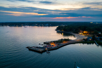 Aerial view at Branford Point in Branford, CT with New Haven, CT in the background during sunset - obrazy, fototapety, plakaty
