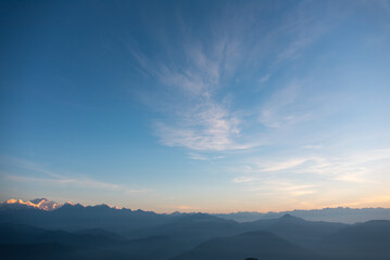 Naklejka na ściany i meble Beautiful first light of dawn on mountain landscape.
