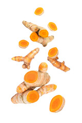 Turmeric spice with cut slices  flying in the air isolated on white background.