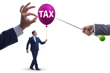Businessman in tax balloon concept