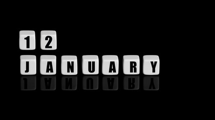 January 12th. Day 12 of month, Calendar date. White cubes with text on black background with reflection.Winter month, day of year concept