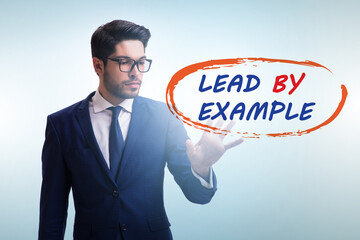 Businessman in lead by example concept