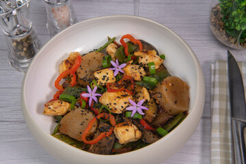 Recipe for grilled chicken breast, pre-cooked cassava paste, coconut bean, aubergine, onion, tomato, cebette. High quality photo