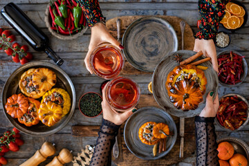 Celebration dinner with family. Rose wine and stuffed pumpkin with rice and vegetables