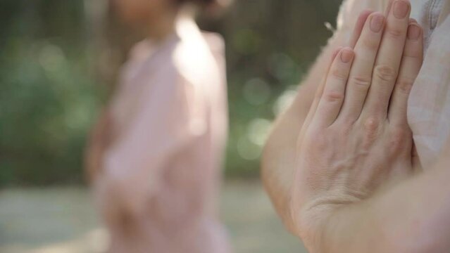 Folded hands in namaskaram Isha yoga
