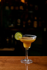 Lemon Margarita cocktails on vibrant turquoise with copyspace