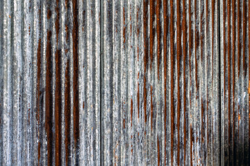Artistic of old and rusty zinc sheet wall. Vintage style metal sheet roof texture. Pattern of old metal sheet. Rusting metal or siding. Corrosion of galvanized. Background and texture in retro concept