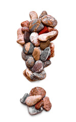 A letter of smooth stones on a white isolated background. Of the river stones lined with a letter, detailing, close-up. Selective focus