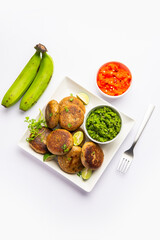 Raw Banana Cutlet also called plantain or kacche kele ki tikki or patties, served with chutney