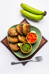 Raw Banana Cutlet also called plantain or kacche kele ki tikki or patties, served with chutney