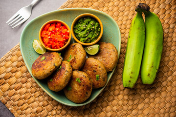 Raw Banana Cutlet also called plantain or kacche kele ki tikki or patties, served with chutney