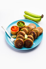 Raw Banana Cutlet also called plantain or kacche kele ki tikki or patties, served with chutney