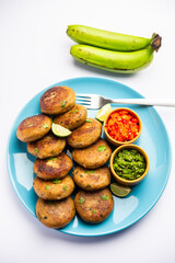 Raw Banana Cutlet also called plantain or kacche kele ki tikki or patties, served with chutney