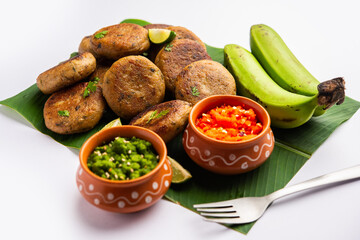 Raw Banana Cutlet also called plantain or kacche kele ki tikki or patties, served with chutney
