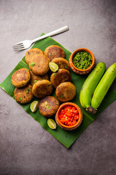 Raw Banana Cutlet also called plantain or kacche kele ki tikki or patties, served with chutney