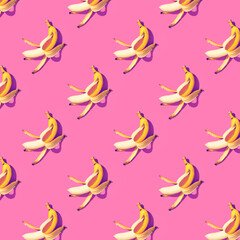 Yellow ripe bananas on pink background pattern
