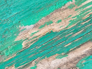 Old rustic wooden table top view. The wooden scuffed surface is green. Textured backgrounds with...