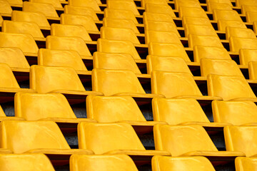 Rows of plastic seats at the stadium 