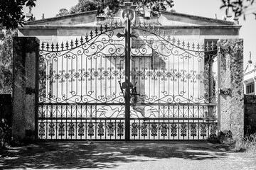 Wrought iron gate in a cemetery of a village in Galicia (Spain)